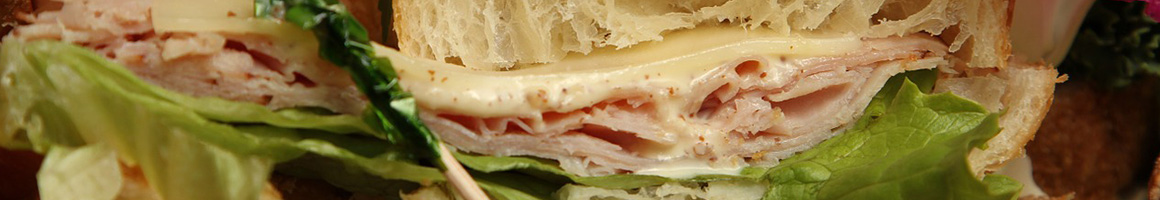 Eating Sandwich at Saquella Cafe restaurant in Boca Raton, FL.